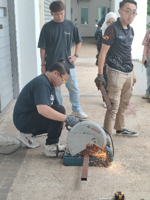 A group of people using a circular saw